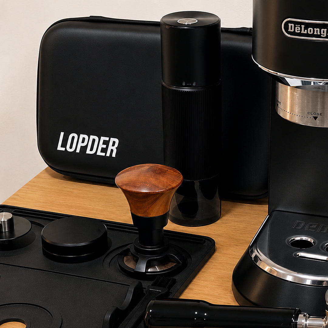 Lopder MAXA electric coffee grinder beside a home espresso setup